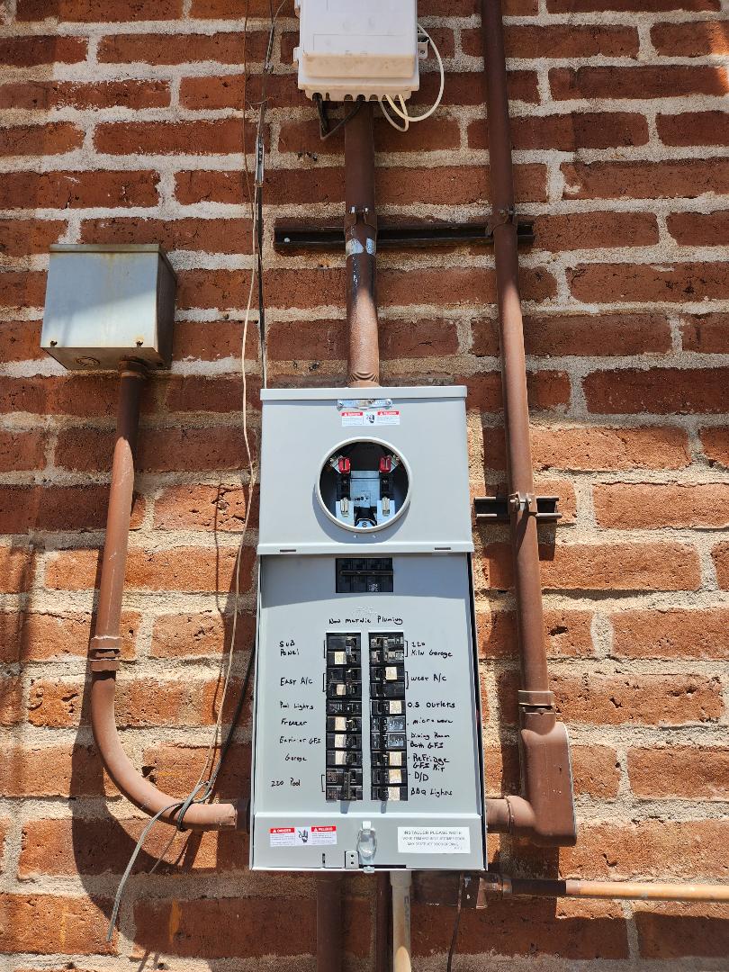 Newly installed meter socket and main breaker panel with clearly labeled circuits